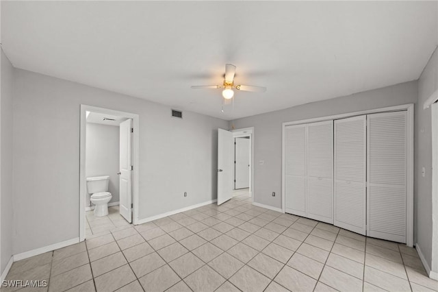 5032 Chiquita Blvd S Unit 101, Cape Coral, FL 33914 - unfurnished bedroom with a closet, baseboards, a ceiling fan, and ensuite bath