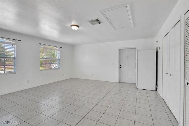 empty room with attic access and visible vents