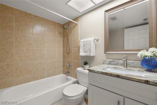 bathroom with shower / bath combination, vanity, visible vents, and toilet