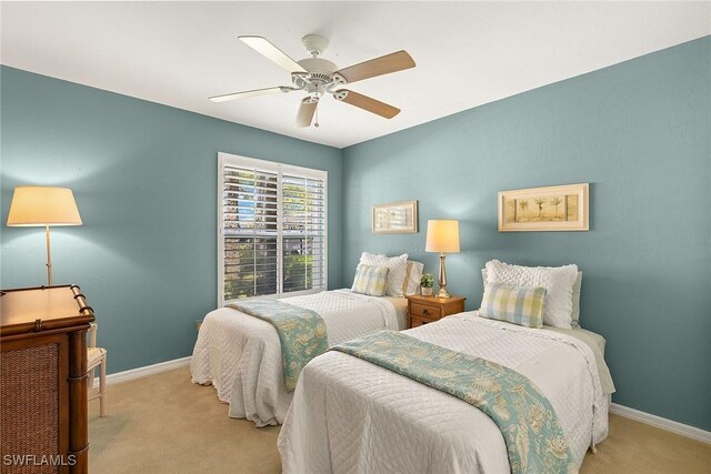 bedroom with baseboards, a ceiling fan, and carpet flooring