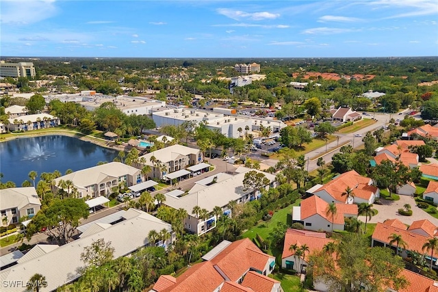 drone / aerial view with a water view and a residential view
