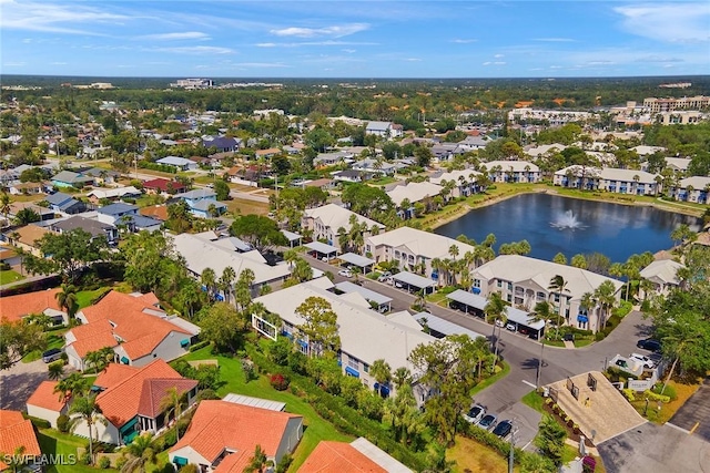 bird's eye view featuring a water view and a residential view