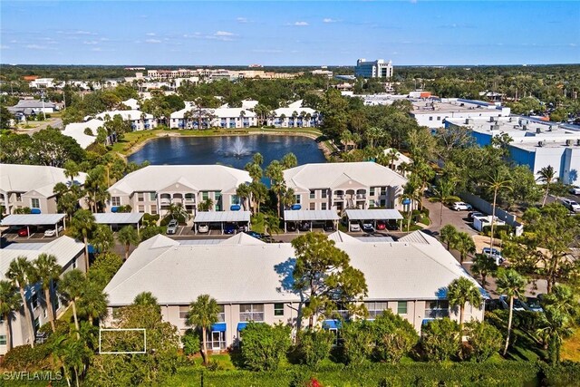 birds eye view of property featuring a residential view and a water view