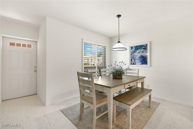 dining room with baseboards