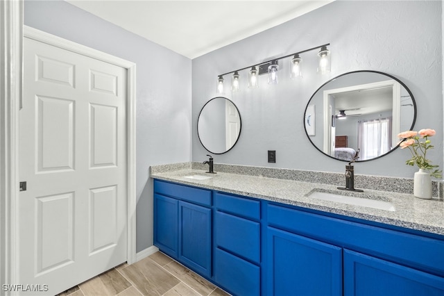 full bath with double vanity and a sink