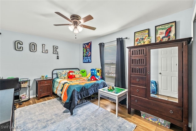 bedroom with wood finished floors and ceiling fan