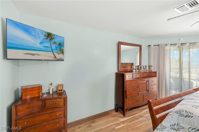 bedroom featuring visible vents and light wood-style flooring