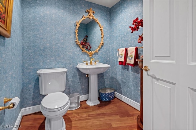 8787 Bay Colony Dr Unit 803, Naples, FL 34108 - bathroom featuring wood finished floors, toilet, baseboards, and wallpapered walls
