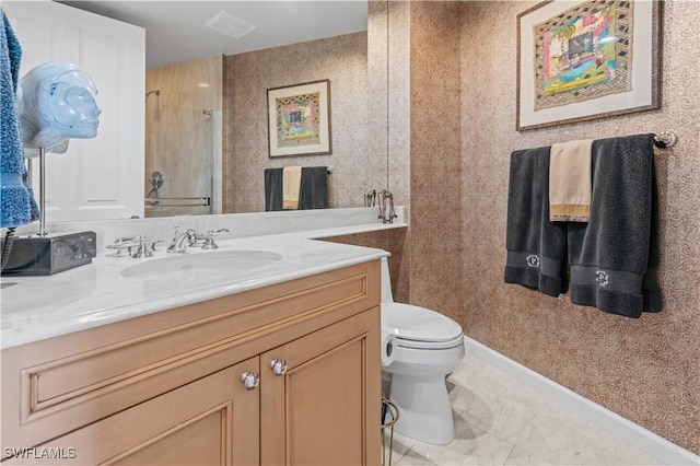 8787 Bay Colony Dr Unit 803, Naples, FL 34108 - bathroom featuring a tile shower, toilet, marble look tile flooring, vanity, and baseboards
