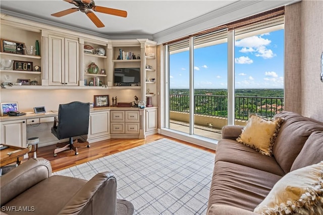 8787 Bay Colony Dr Unit 803, Naples, FL 34108 - home office with built in study area, light wood-style floors, ornamental molding, and ceiling fan