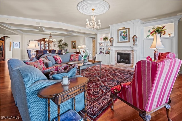 8787 Bay Colony Dr Unit 803, Naples, FL 34108 - living room with a chandelier, arched walkways, wood finished floors, coffered ceiling, and a high end fireplace
