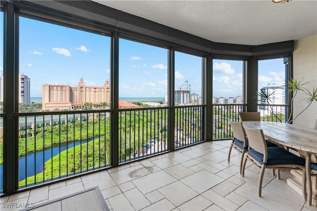 8787 Bay Colony Dr Unit 803, Naples, FL 34108 - sunroom / solarium with a view of city, a water view, and healthy amount of natural light