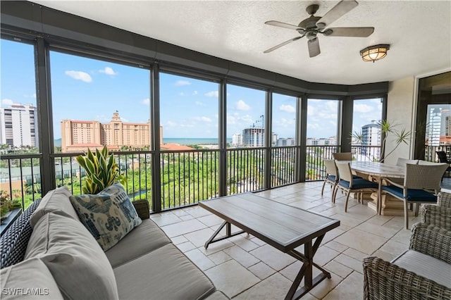 8787 Bay Colony Dr Unit 803, Naples, FL 34108 - sunroom / solarium with a view of city, a textured ceiling, and tile patterned flooring