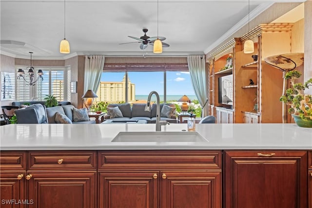 8787 Bay Colony Dr Unit 803, Naples, FL 34108 - kitchen with a sink, open floor plan, light countertops, and ornamental molding