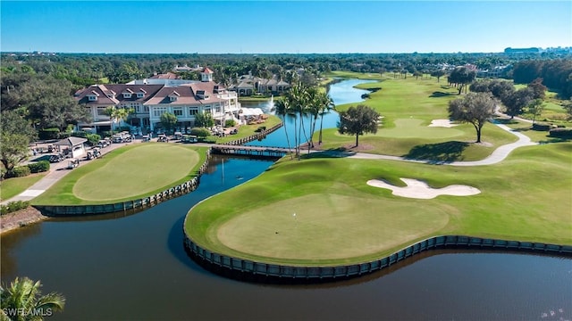 8787 Bay Colony Dr Unit 803, Naples, FL 34108 - drone / aerial view of a large body of water, a local golf course, and a tree filled landscape