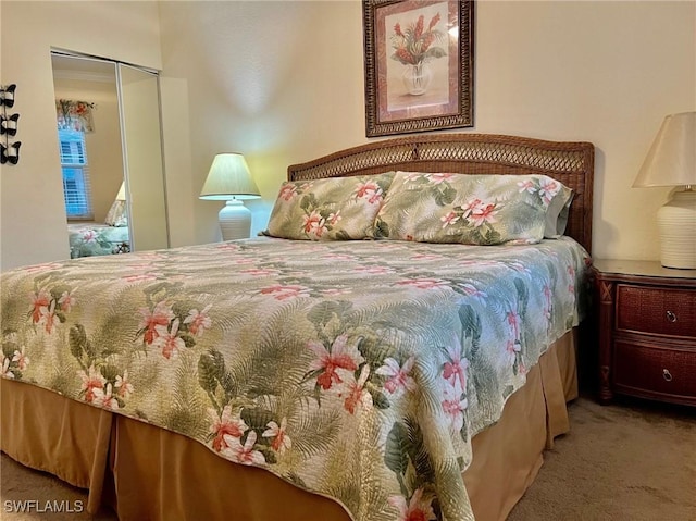 bedroom with carpet flooring and a closet