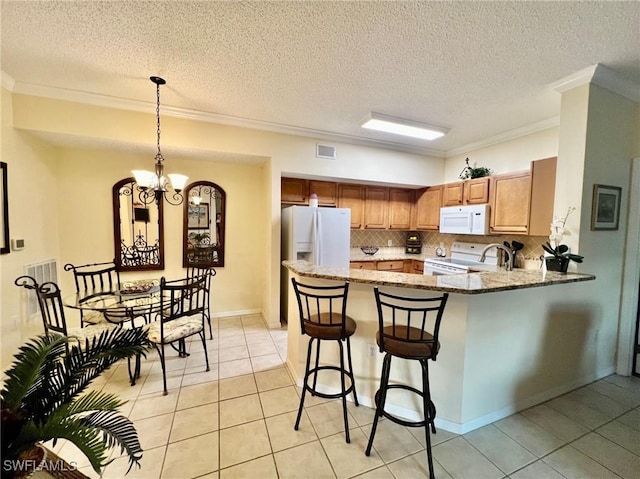 kitchen featuring ornamental molding, white appliances, light tile patterned flooring, a peninsula, and tasteful backsplash