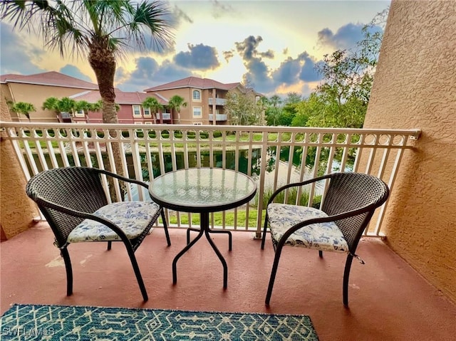 view of balcony at dusk