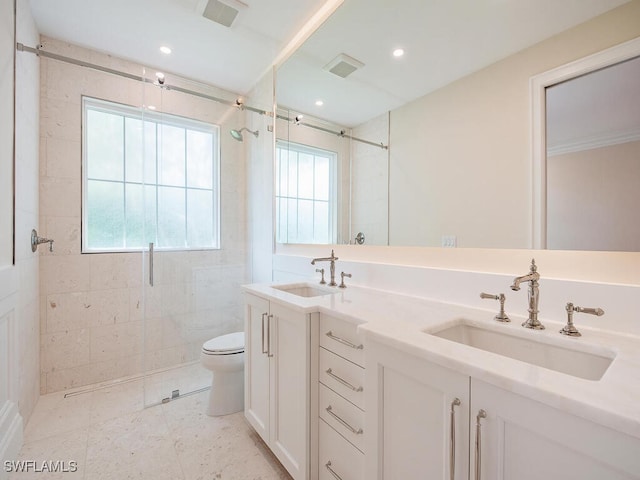 full bathroom featuring a sink, visible vents, and a tile shower