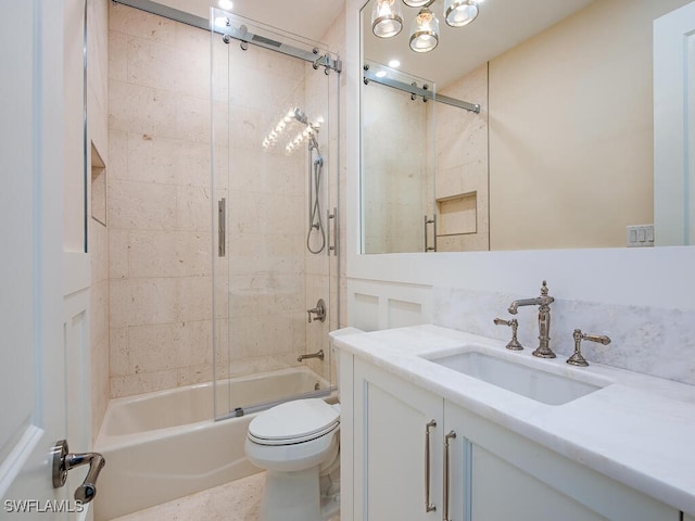 bathroom with toilet, vanity, and enclosed tub / shower combo