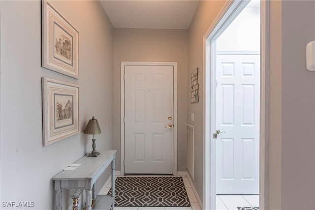 14500 Daffodil Dr Unit 1102, Fort Myers, FL 33919 - doorway to outside with baseboards and light tile patterned flooring