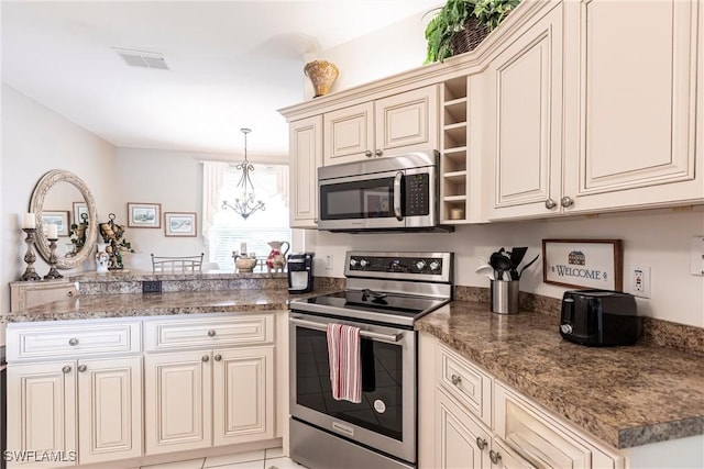 14500 Daffodil Dr Unit 1102, Fort Myers, FL 33919 - kitchen with a peninsula, open shelves, visible vents, stainless steel appliances, and a notable chandelier