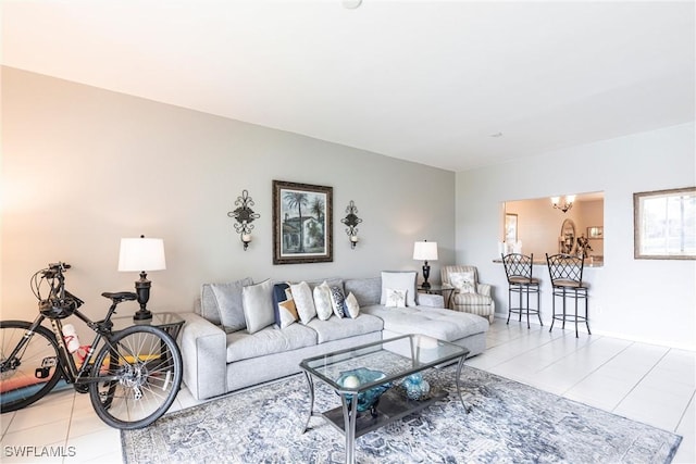 14500 Daffodil Dr Unit 1102, Fort Myers, FL 33919 - living room with light tile patterned floors and a notable chandelier