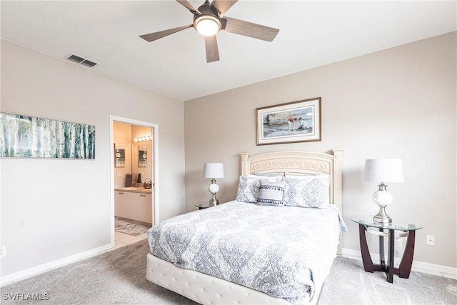 14500 Daffodil Dr Unit 1102, Fort Myers, FL 33919 - carpeted bedroom with visible vents, baseboards, a ceiling fan, and ensuite bathroom