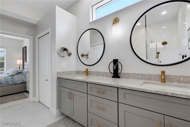 26036 Clarkston Dr, Bonita Springs, FL 34135 - ensuite bathroom with marble finish floors, double vanity, a marble finish shower, and plenty of natural light