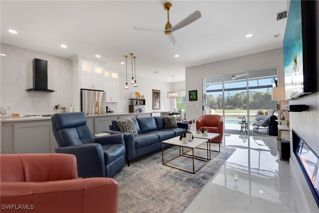 26036 Clarkston Dr, Bonita Springs, FL 34135 - living room with light marble finish floors, ceiling fan, and recessed lighting