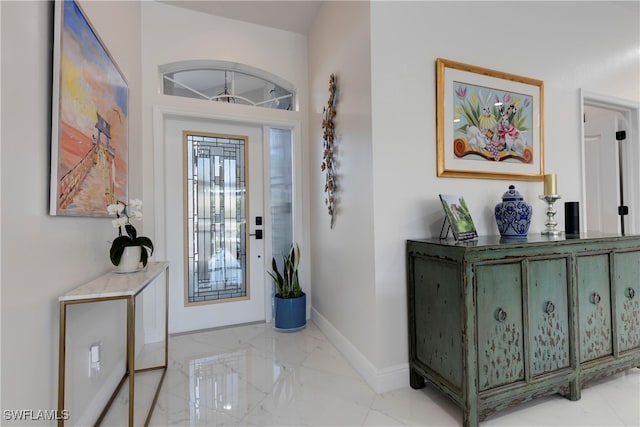 26036 Clarkston Dr, Bonita Springs, FL 34135 - foyer entrance featuring light marble finish flooring and baseboards