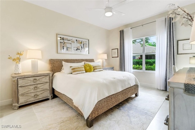 bedroom featuring ceiling fan and baseboards