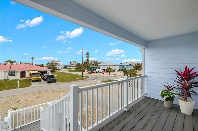 7868 Buccaneer Dr, Fort Myers Beach, FL 33931 - wooden terrace with a porch and a residential view