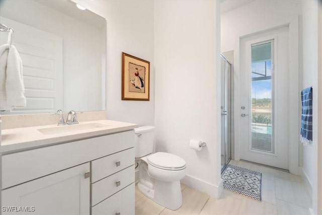 4151 Traditions Dr, Ave Maria, FL 34142 - bathroom featuring baseboards, toilet, vanity, tile patterned flooring, and a stall shower