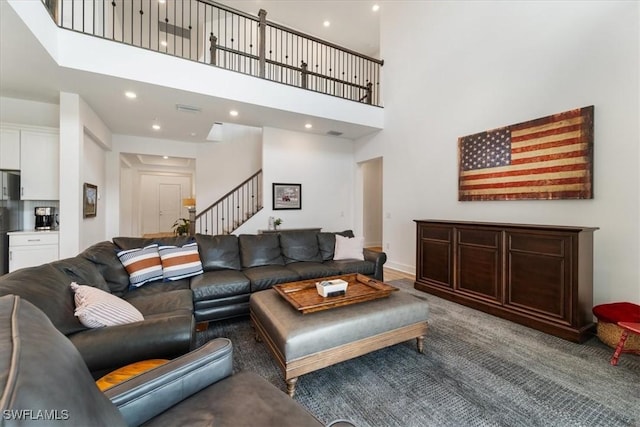 4151 Traditions Dr, Ave Maria, FL 34142 - carpeted living area with recessed lighting, stairs, and a high ceiling