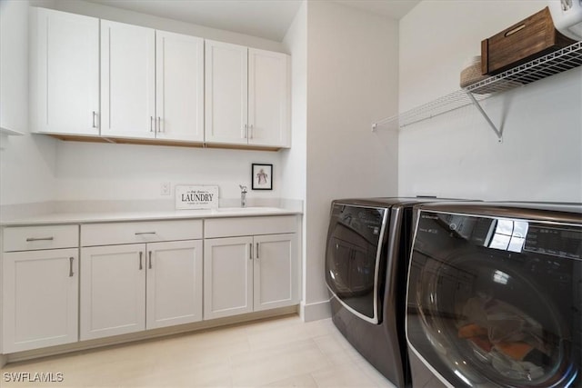 4151 Traditions Dr, Ave Maria, FL 34142 - laundry area with light tile patterned flooring, separate washer and dryer, a sink, and cabinet space