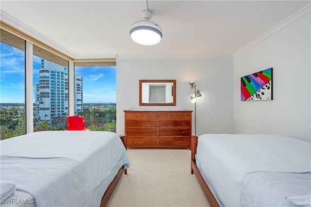 bedroom with carpet flooring, ornamental molding, and a view of city