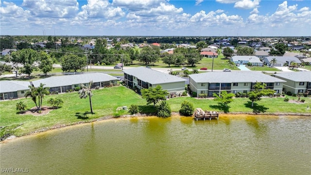 birds eye view of property with a residential view and a water view