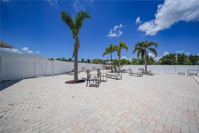 view of patio / terrace featuring fence