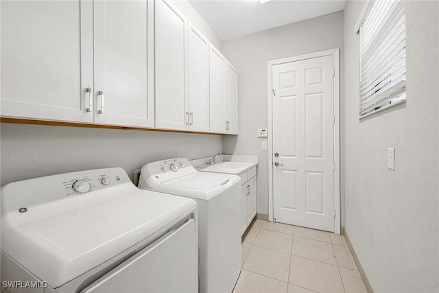 11643 Riverstone Ln, Fort Myers, FL 33913 - washroom featuring baseboards, light tile patterned floors, washing machine and dryer, cabinet space, and a sink