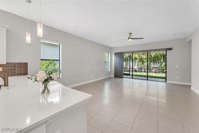 11643 Riverstone Ln, Fort Myers, FL 33913 - interior space with light tile patterned floors, baseboards, and ceiling fan