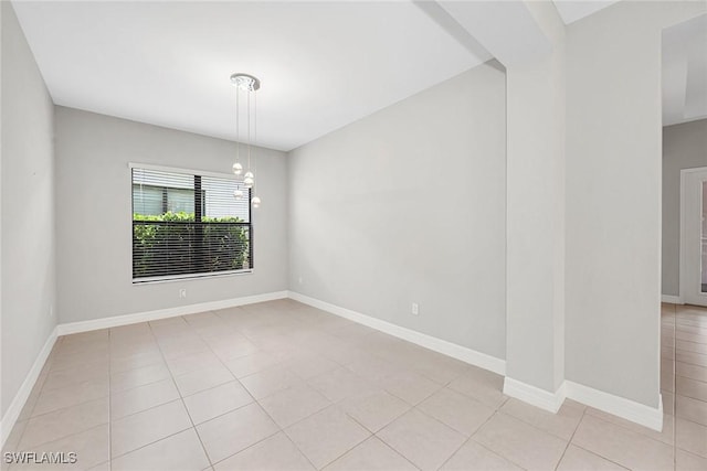 11643 Riverstone Ln, Fort Myers, FL 33913 - empty room featuring light tile patterned floors and baseboards