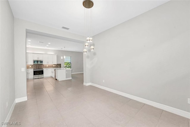 11643 Riverstone Ln, Fort Myers, FL 33913 - unfurnished living room with visible vents, baseboards, recessed lighting, and light tile patterned floors
