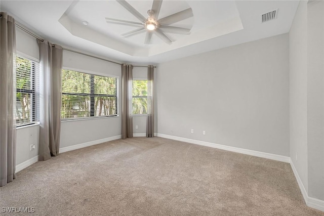 11643 Riverstone Ln, Fort Myers, FL 33913 - empty room with visible vents, baseboards, a raised ceiling, and a ceiling fan