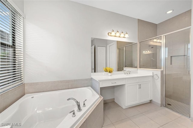 11643 Riverstone Ln, Fort Myers, FL 33913 - full bathroom with tile patterned flooring, a bath, a stall shower, and vanity