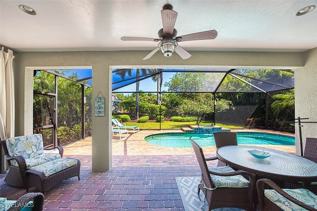 12740 Seaside Key Ct, North Fort Myers, FL 33903 - outdoor pool featuring a patio, a lanai, a jacuzzi, and ceiling fan