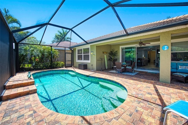 12740 Seaside Key Ct, North Fort Myers, FL 33903 - swimming pool featuring a patio area, ceiling fan, a lanai, and outdoor dining area