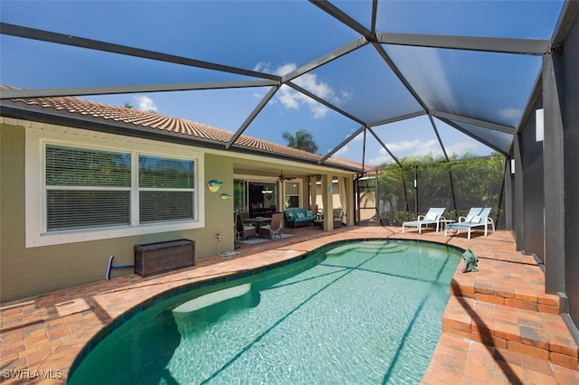 12740 Seaside Key Ct, North Fort Myers, FL 33903 - outdoor pool with a patio, a ceiling fan, and an outdoor living space