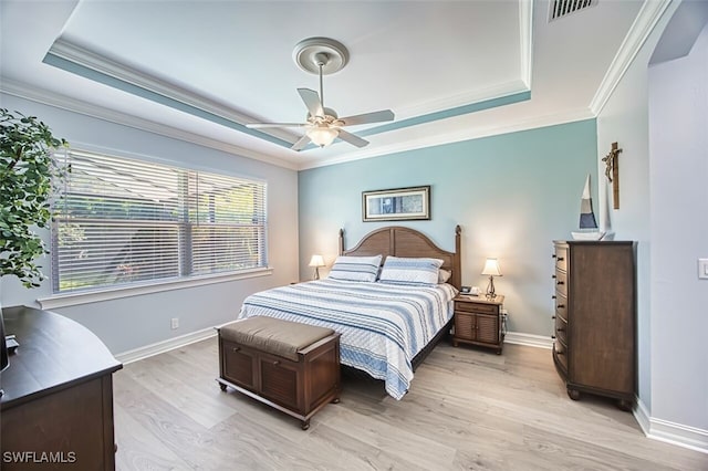 12740 Seaside Key Ct, North Fort Myers, FL 33903 - bedroom featuring a raised ceiling, light wood-type flooring, crown molding, and ceiling fan