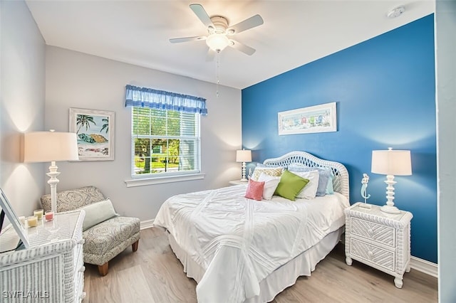 12740 Seaside Key Ct, North Fort Myers, FL 33903 - bedroom with wood finished floors and a ceiling fan